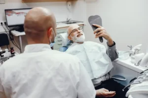 old man sitting dentist office